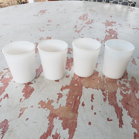 Four small vintage milk glasses